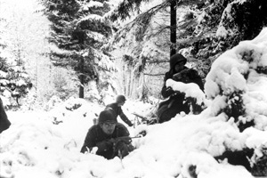 American soldiers taking up defensive positions in the Ardennes during the Battle of the Bulge